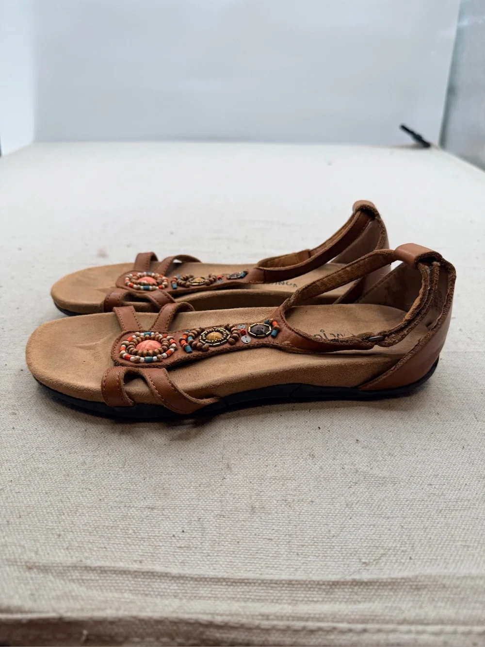 Minnetonka Women's Tan Beaded T-Strap Sandals